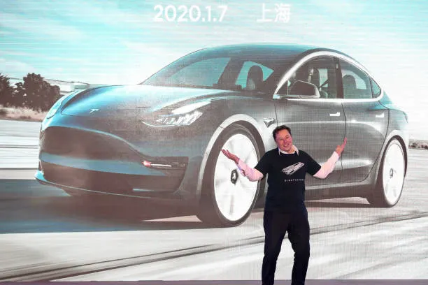 tesla-ceo-elon-musk-gestures-during-the-tesla-china-made-model-3-delivery-ceremony-in
